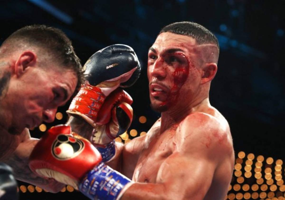 NEW YORK, NEW YORK - NOVEMBER 27: Teofimo Lopez punches George Kambosos during their championship bout for Lopezs Undisputed Lightweight title at The Hulu Theater at Madison Square Garden on November 27, 2021 in New York, New York. Al Bello/Getty Images/AFP (Photo by AL BELLO / GETTY IMAGES NORTH AMERICA / Getty Images via AFP)