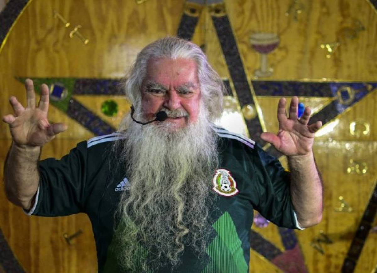 Antonio Vazquez, the self-appointed 'Brujo Mayor' or Grand Warlock of Mexico, gestures during a press conference in Mexico City on June 13, 2018, where he predicted Mexico's performance in the 2018 soccer World Cup and performed a ritual to bring the national team good luck. / AFP PHOTO / RONALDO SCHEMIDT