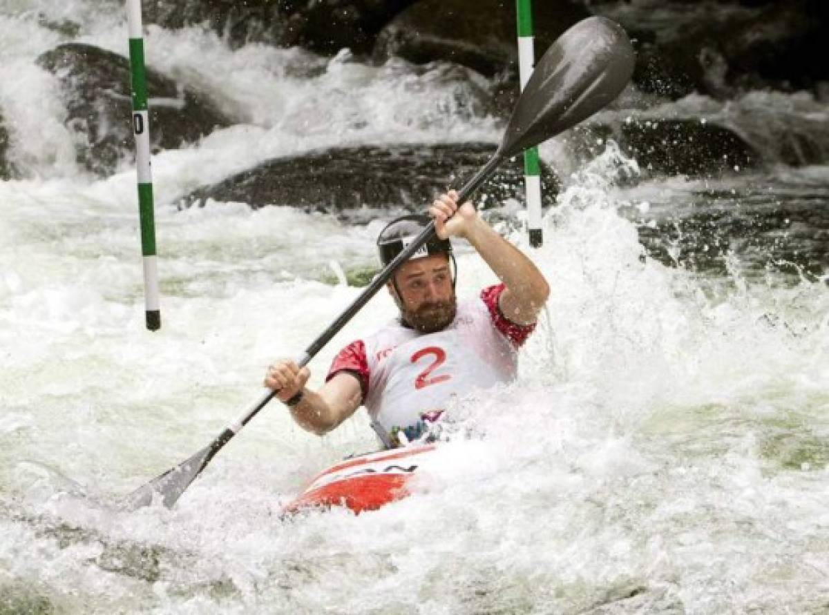 Canada's Ben Hayward runs the Minden white water course in the Men's Solo Kayak Slalom category in a qualifying round at the Toronto 2015 Pan Am Games in Minden, Ont., on Saturday, July 18, 2015. He will paddle for gold Sunday, July 19, 2015 in the medal round. THE CANADIAN PRESS/Fred Thornhill