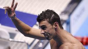 El nadador nortemericano, Michael Phelps, celebra la clasificación a la gran final de los 100 metros mariposa y este martes buscará su medalla 24 y su dorada 20.