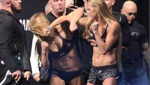 Ronda Rousey defenderá este sábado su campeonato peso gallo de la UFC ante Holly Holm, en el evento UFC 193, que será en Australia. Este día se llevó a cabo el pesaje y su rival le propini un golpe en el rostro.