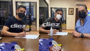 Roberto Moreira y Jonathan Rougier al momento de estampar su firma con Motagua por un año más.