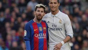 Lionel Messi junto a Cristiano Ronaldo en el último clásico disputado.
