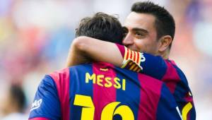 Xavi celebrando uno de los goles de Messi en el Camp Nou.