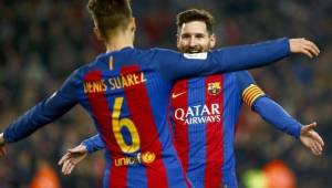 Denis Suárez y Messi festejando juntos con el Barcelona.