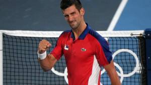 Serbia's Novak Djokovic celebrates defeating Japan's Kei Nishikori during their Tokyo 2020 Olympic Games men's singles quarterfinal tennis match at the Ariake Tennis Park in Tokyo on July 29, 2021. (Photo by Tiziana FABI / AFP)