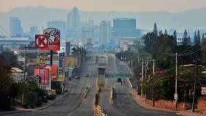 Picture of Suyapa Avenue in Tegucigalpa, seen almost empty due to precautionary measures taken against the spread of the new coronavirus, COVID-19, on April 26, 2020. (Photo by ORLANDO SIERRA / AFP)