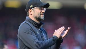 Liverpool's German manager Jurgen Klopp applauds at the end of the English Premier League football match between Liverpool and Wolverhampton Wanderers at Anfield in Liverpool, north west England on May 12, 2019. (Photo by Paul ELLIS / AFP) / RESTRICTED TO EDITORIAL USE. No use with unauthorized audio, video, data, fixture lists, club/league logos or 'live' services. Online in-match use limited to 120 images. An additional 40 images may be used in extra time. No video emulation. Social media in-match use limited to 120 images. An additional 40 images may be used in extra time. No use in betting publications, games or single club/league/player publications. /