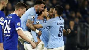 Manchester City's German midfielder Leroy Sane (C) is congratulated by teammates after scoring a goal during the UEFA Champions League round of 16 first leg football match between Schalke 04 and Manchester City on February 20, 2019 in Gelsenkirchen, Germany. (Photo by Odd ANDERSEN / AFP)