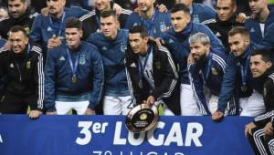 Members of Argentina's national team pose for pictures after receiving their medals and trophy after defeating Chile 2-1 in the Copa America football tournament third-place match at the Corinthians Arena in Sao Paulo, Brazil, on July 6, 2019. (Photo by Nelson ALMEIDA / AFP)