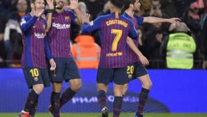 Barcelona's Uruguayan forward Luis Suarez (2L) celebrates his goal with teammates during the Spanish League football match between FC Barcelona and SD Eibar at the Camp Nou stadium in Barcelona on January 13, 2019. (Photo by LLUIS GENE / AFP)