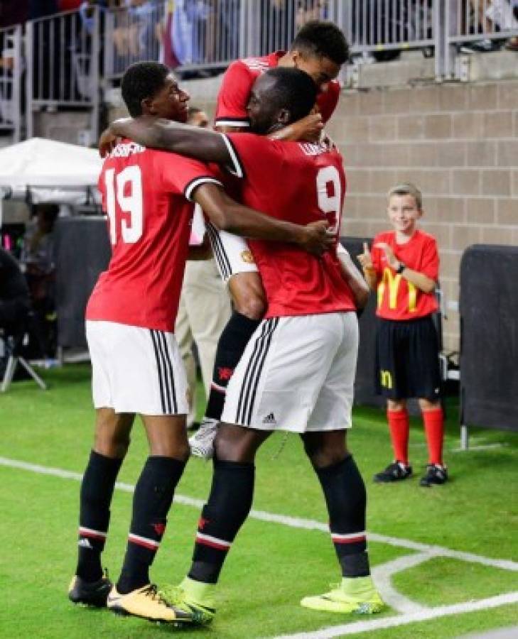 HOUSTON, TX - JULY 20: Manchester United forward Romelu Lukaku #9 celebrates with forward Marcus Rashford #19 and midfielder Jesse Lingard #14 after scoring against Manchester City at NRG Stadium on July 20, 2017 in Houston, Texas. Bob Levey/Getty Images/AFP== FOR NEWSPAPERS, INTERNET, TELCOS & TELEVISION USE ONLY ==