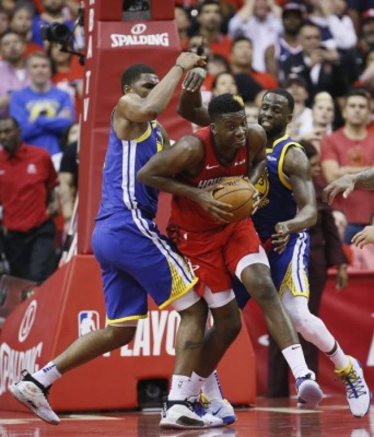 HOUSTON, TEXAS - MAY 10: Clint Capela #15 of the Houston Rockets is double teamed by Draymond Green #23 of the Golden State Warriors and Kevon Looney #5 during Game Six of the Western Conference Semifinals of the 2019 NBA Playoffs at Toyota Center on May 10, 2019 in Houston, Texas. NOTE TO USER: User expressly acknowledges and agrees that, by downloading and or using this photograph, User is consenting to the terms and conditions of the Getty Images License Agreement. Bob Levey/Getty Images/AFP