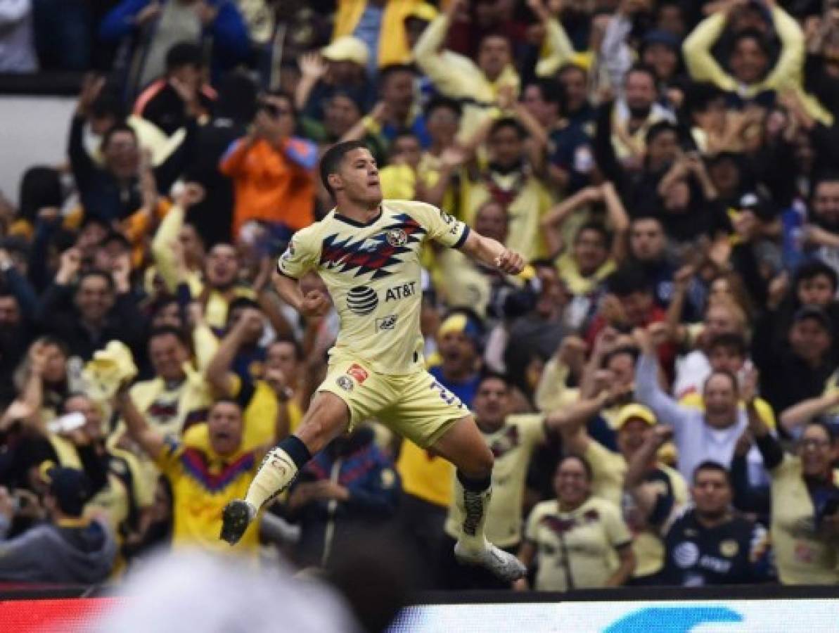America's Richard Sanchez celebrate after scoring against Monterrey during their Mexican Apertura Tournament football final at the Azteca stadium in Mexico City, on December 29, 2019. (Photo by RODRIGO ARANGUA / AFP)