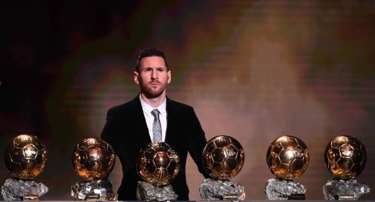TOPSHOT - Barcelona's Argentinian forward Lionel Messi reacts after winning the Ballon d'Or France Football 2019 trophy at the Chatelet Theatre in Paris on December 2, 2019. - Lionel Messi won a record-breaking sixth Ballon d'Or on Monday after another sublime year for the Argentinian, whose familiar brilliance remained undimmed even through difficult times for club and country. (Photo by FRANCK FIFE / AFP)