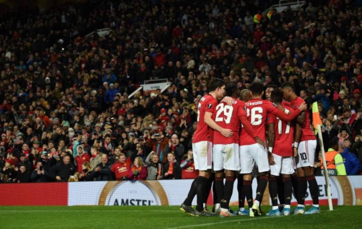 Manchester United players celebrate Manchester United's French striker Anthony Martial goal during the UEFA Europa League Group L football match between Manchester United and Partizan Belgrade at Old Trafford in Manchester, north west England, on November 7, 2019. - Manchester United won the game 3-0. (Photo by Oli SCARFF / AFP)