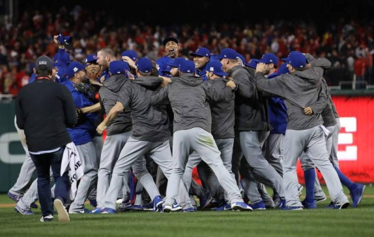 WASHINGTON, DC - OCTOBER 13: The Chicago Cubs celebrate after the final out of Game 5 of the National League Divisional Series at Nationals Park on October 13, 2017 in Washington, DC. The Cubs won the game 9-8 and will advance to the National League Championship Series against the Los Angeles Dodgers. Win McNamee/Getty Images/AFP== FOR NEWSPAPERS, INTERNET, TELCOS & TELEVISION USE ONLY ==