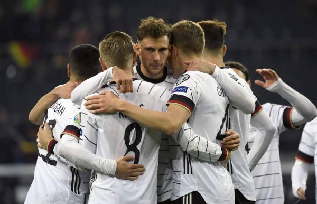 Germany's Leon Goretzka is congratulated by teammates after he scored a goal during the UEFA Euro 2020 Group C qualification football match between Germany and Belarus, on November 16, 2019 in Moenchengladbach. (Photo by INA FASSBENDER / AFP)