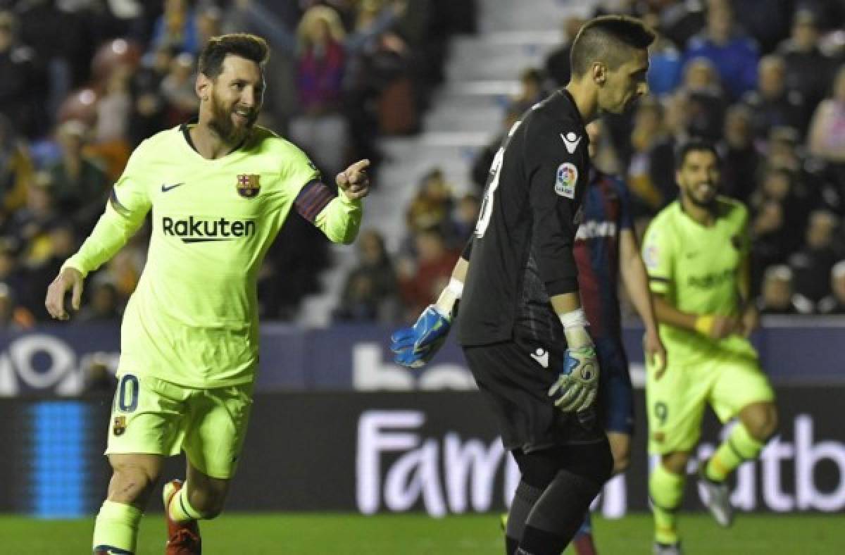 Barcelona's Argentinian forward Lionel Messi celebrates after scoring a goal during the Spanish League football match between Levante and Barcelona at the Ciutat de Valencia stadium in Valencia on December 16, 2018. (Photo by JOSE JORDAN / AFP)