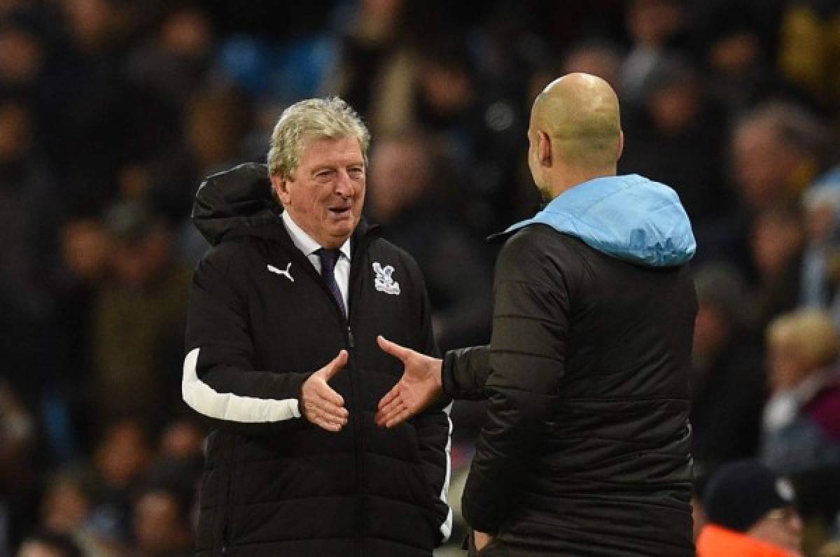 Crystal Palace's English manager Roy Hodgson (L) and Manchester City's Spanish manager Pep Guardiola react at the final whistle during the English Premier League football match between Manchester City and Crystal Palace at the Etihad Stadium in Manchester, north west England, on January 18, 2020. (Photo by Oli SCARFF / AFP) / RESTRICTED TO EDITORIAL USE. No use with unauthorized audio, video, data, fixture lists, club/league logos or 'live' services. Online in-match use limited to 120 images. An additional 40 images may be used in extra time. No video emulation. Social media in-match use limited to 120 images. An additional 40 images may be used in extra time. No use in betting publications, games or single club/league/player publications. /