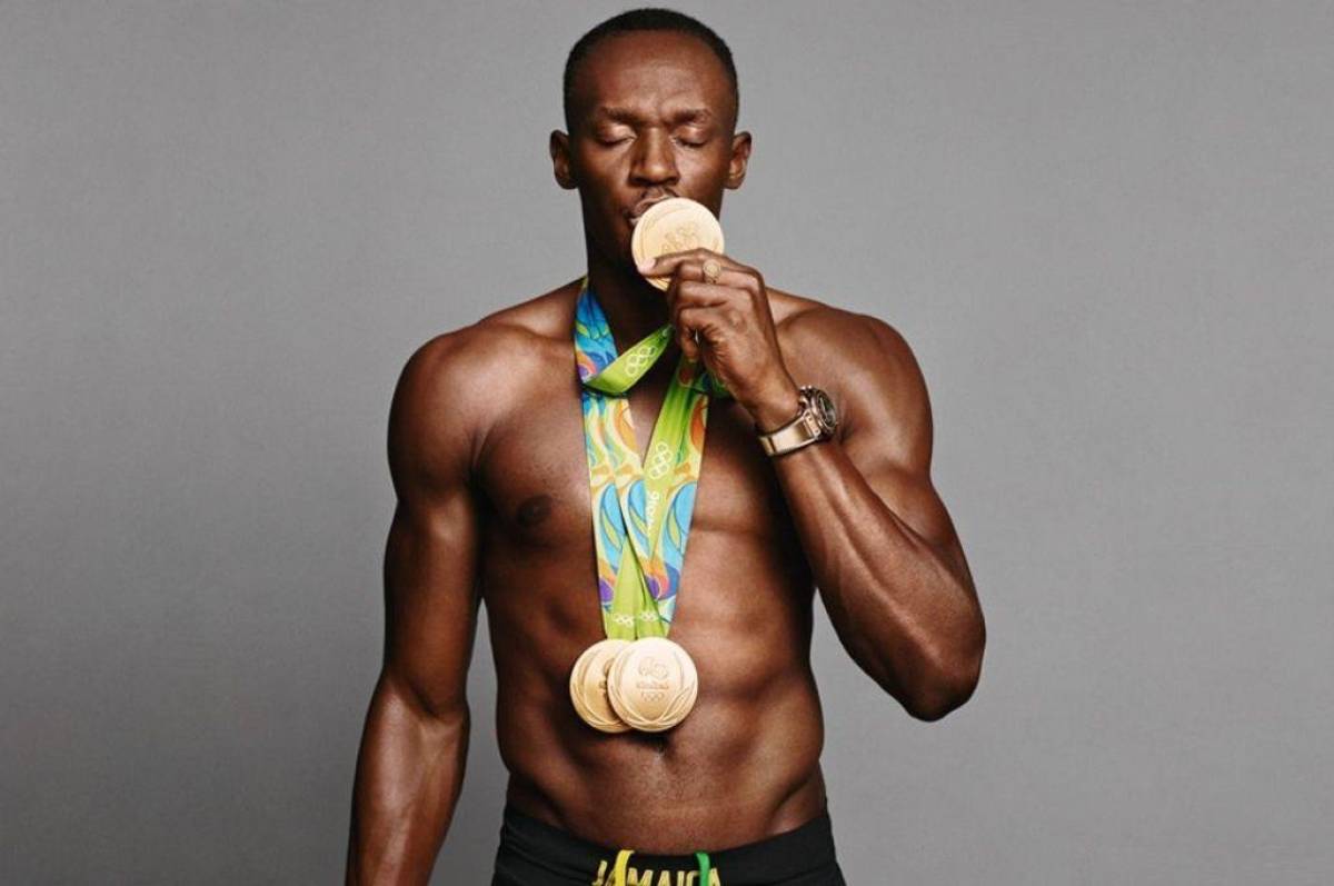 Usain Bolt con su medallas de Juegos Olimpicos.