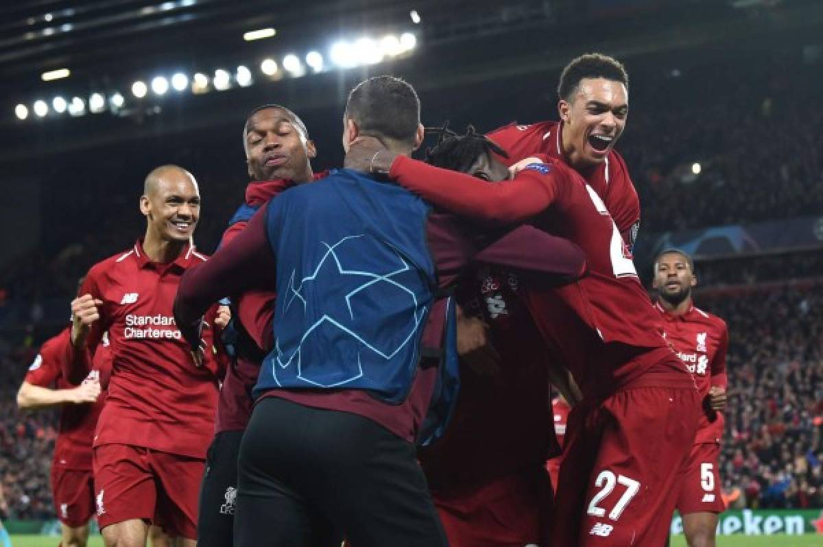 The Liverpool celebrate after scoring their fourth goal during the UEFA Champions league semi-final second leg football match between Liverpool and Barcelona at Anfield in Liverpool, north west England on May 7, 2019. (Photo by Paul ELLIS / AFP)