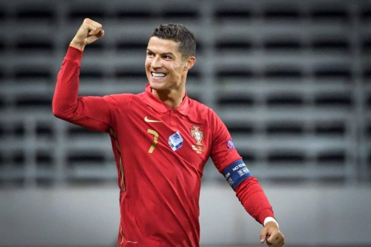 Portugal's forward Cristiano Ronaldo celebrates scoring the opening goal, his 100th goal for Portugal, during the UEFA Nations League football match between Sweden and Portugal on September 8, 2020 in Solna, Sweden. (Photo by Janerik HENRIKSSON / TT NEWS AGENCY / AFP) / Sweden OUT