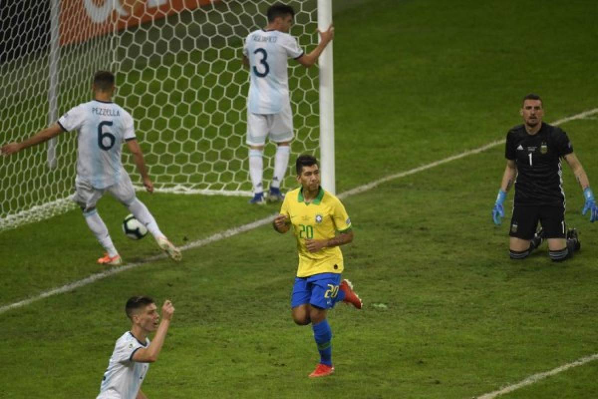 Brazil's Roberto Firmino celebrates after scoring against Argentina during their Copa America football tournament semi-final match at the Mineirao Stadium in Belo Horizonte, Brazil, on July 2, 2019. (Photo by Mauro PIMENTEL / AFP)