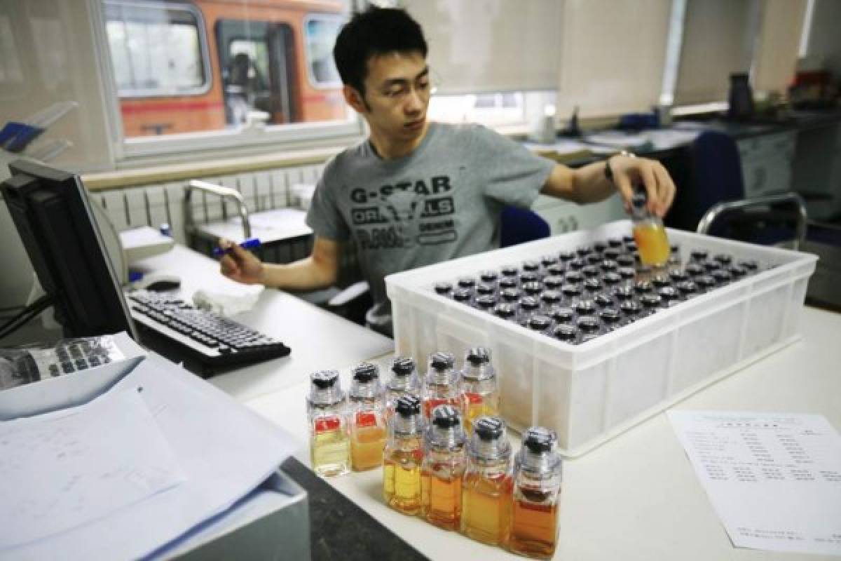 FILE - In this Monday, June 30, 2008 file photo, urine samples from Chinese athletes are recorded upon arriving at China Anti-Doping Agency in Beijing. The World Anti-Doping Agency has suspended China's National Anti-Doping Laboratory, Thursday, April 21, 2016, for a maximum period of four months for 'non-conformities' with standards. (AP Photo/Robert F. Bukaty, File)