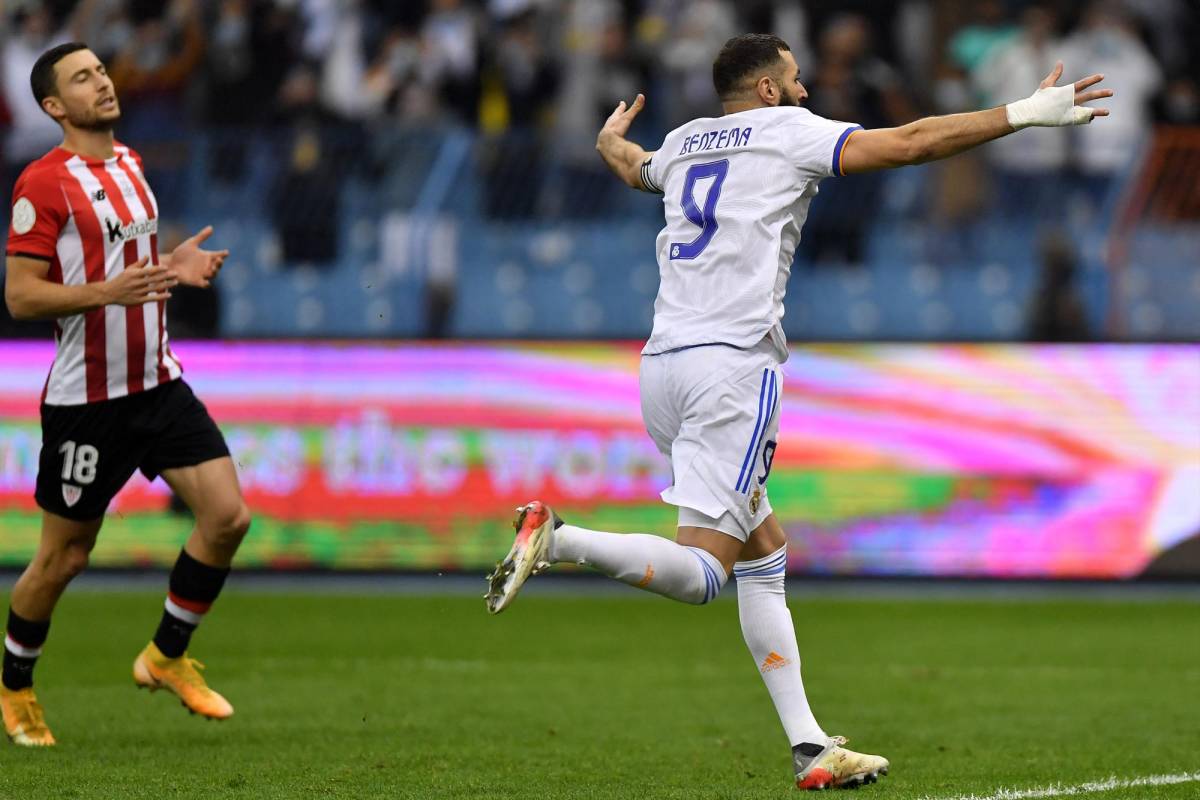 Real Madrid's French forward Karim Benzema celebrates after scoring a penalty during the Spanish Super Cup final football match between Athletic Bilbao and Real Madrid on January 16, 2022, at the King Fahd International stadium in the Saudi capital of Riyadh. (Photo by AFP)