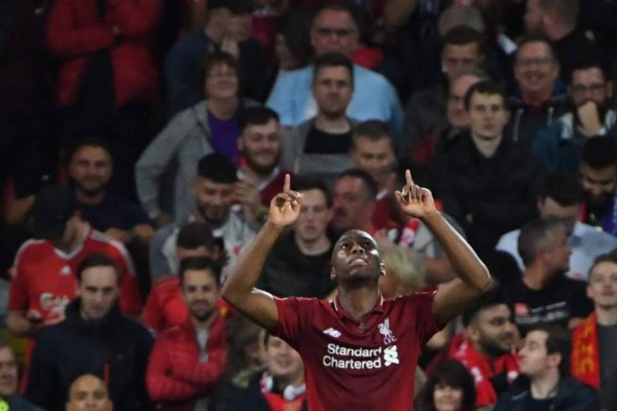Liverpool's English striker Daniel Sturridge celebrates scoring the team's first goal during the UEFA Champions League group C football match between Liverpool and Paris Saint-Germain at Anfield in Liverpool, north west England on September 18, 2018. / AFP PHOTO / Paul ELLIS