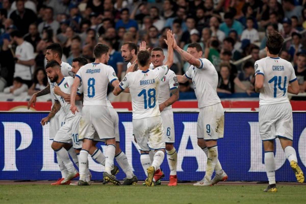 Italy's players celebrate after a goal scored by Italy's Nicolo Barella (C) during the Euro 2020 football qualification match between Greece and Italy at the Olympic Stadium in Athens on June 8, 2019. (Photo by LOUISA GOULIAMAKI / AFP)