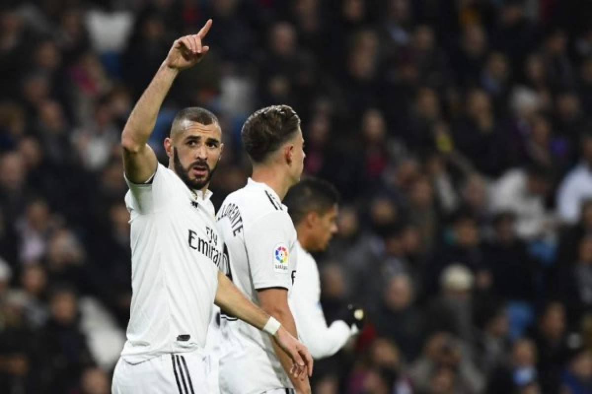 Real Madrid's French forward Karim Benzema celebrates a goal during the Spanish League football match between Real Madrid and Rayo Vallecano at the Santiago Bernabeu stadium in Madrid on December 15, 2018. (Photo by GABRIEL BOUYS / AFP)