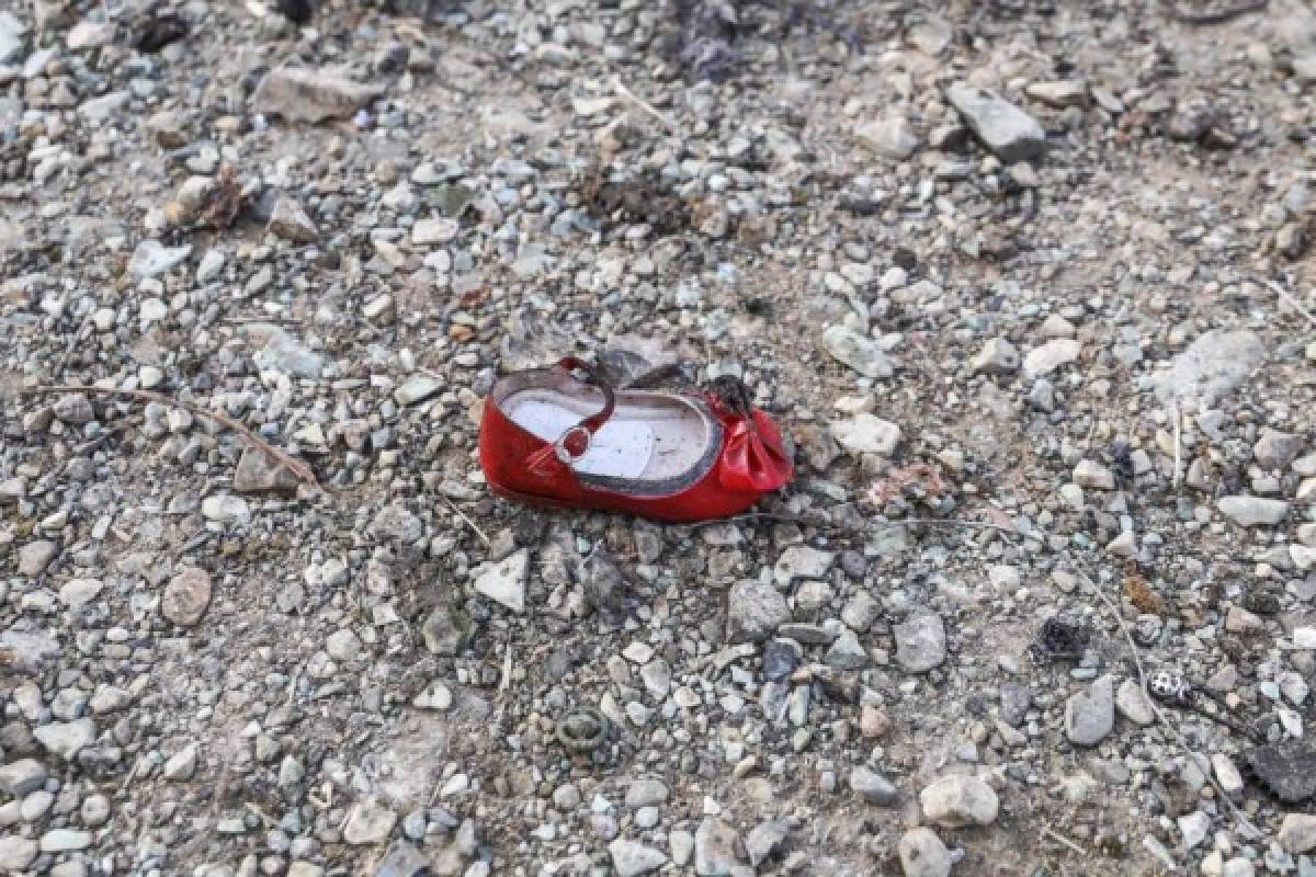 (FILES) In this file photo provided by the Iranian Students News Agency and taken on January 08, 2020, child's shoe lies at the scene of a Ukrainian airliner that crashed January 8, 2020 shortly after take-off near Imam Khomeini airport in the Iranian capital Tehran. - US officials believe that Iran accidentally shot down the Ukrainian airliner, killing all of the 176 people on board, US media reported on January 9, 2020. Newsweek, CBS and CNN quoted unnamed officials saying they are increasingly confident that Iranian air defense systems accidentally downed the aircraft, based on satellite, radar and electronic data. (Photo by Borna GHASSEMI / ISNA / AFP)