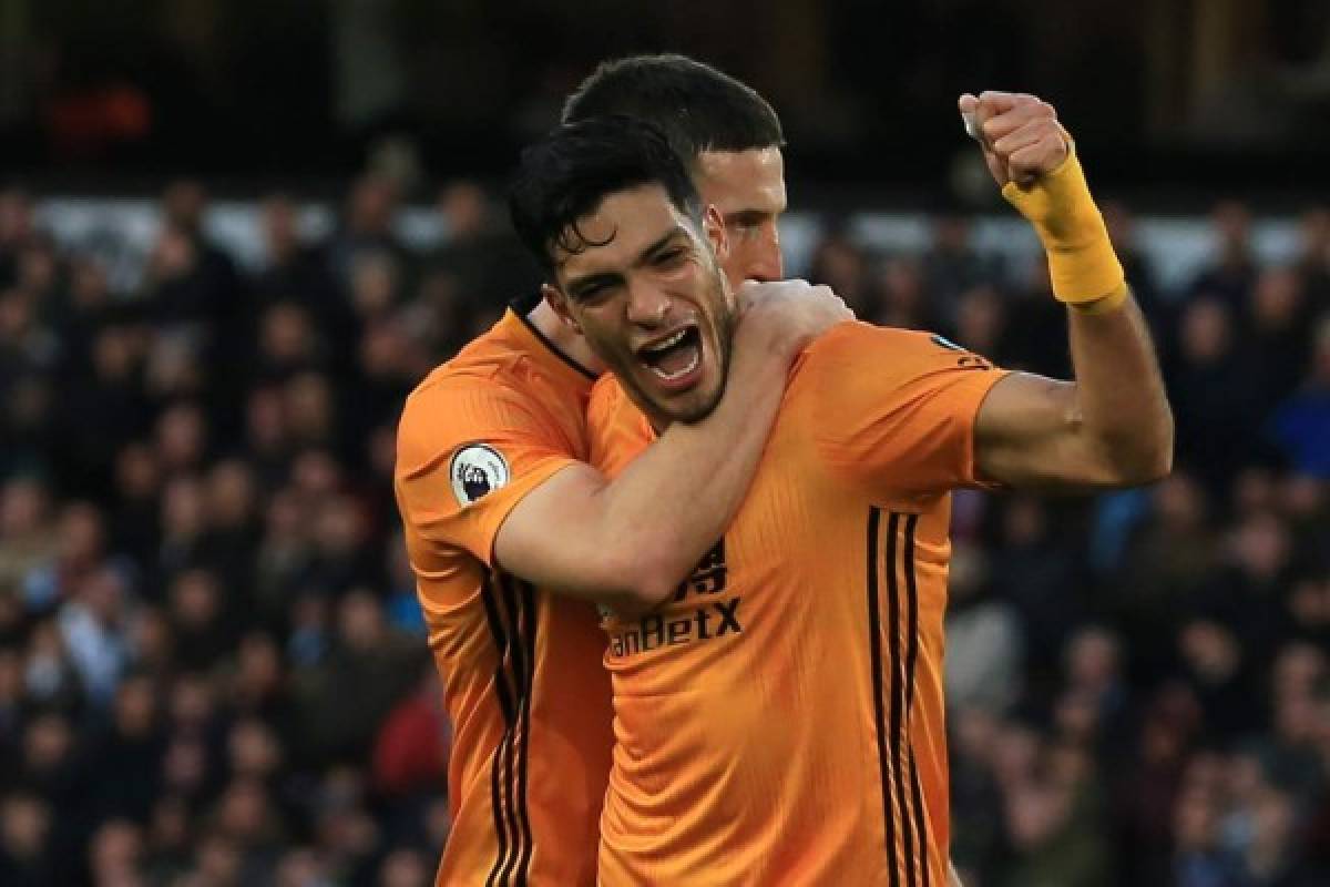 Wolverhampton Wanderers' Mexican striker Raul Jimenez (R) celebrates with Wolverhampton Wanderers' Irish defender Matt Doherty (L) after scoring their second goal during the English Premier League football match between Wolverhampton Wanderers and Aston Villa at the Molineux stadium in Wolverhampton, central England on November 10, 2019. - Wolves won the game 2-1. (Photo by Lindsey Parnaby / AFP) / RESTRICTED TO EDITORIAL USE. No use with unauthorized audio, video, data, fixture lists, club/league logos or 'live' services. Online in-match use limited to 120 images. An additional 40 images may be used in extra time. No video emulation. Social media in-match use limited to 120 images. An additional 40 images may be used in extra time. No use in betting publications, games or single club/league/player publications. /