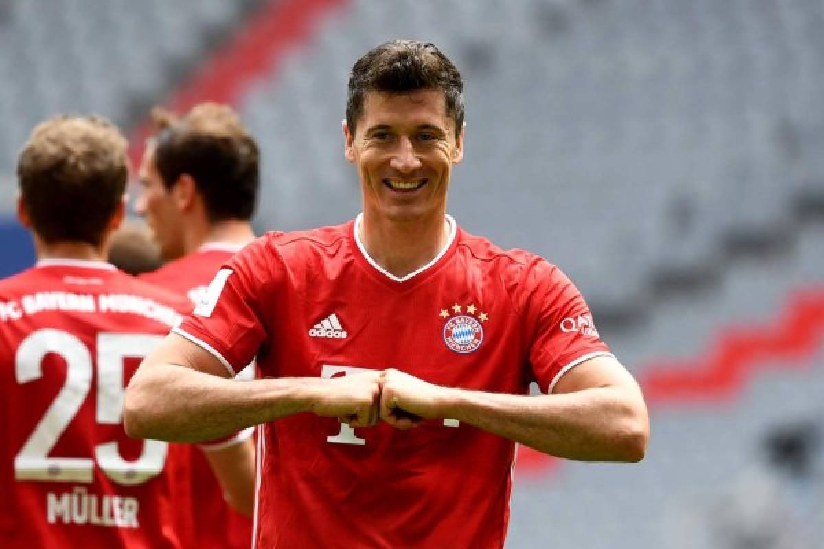 Bayern Munich's Polish forward Robert Lewandowski celebrates after scoring his team's second goal during the German first division Bundesliga football match FC Bayern Munich v SC Freiburg on June 20, 2020 in Munich, southern Germany. (Photo by Sven Hoppe / POOL / AFP) / DFL REGULATIONS PROHIBIT ANY USE OF PHOTOGRAPHS AS IMAGE SEQUENCES AND/OR QUASI-VIDEO