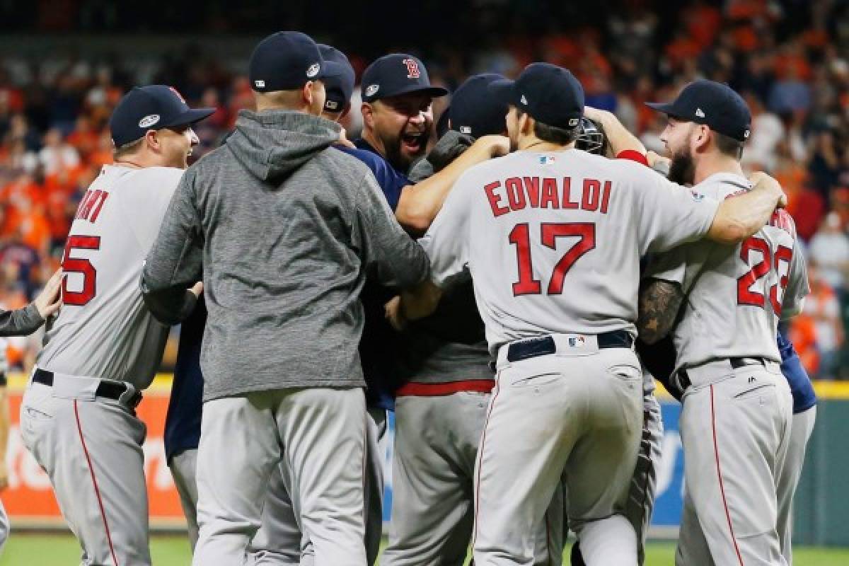 HOUSTON, TX - OCTOBER 18: The Boston Red Sox celebrate defeating the Houston Astros 4-1 in Game Five of the American League Championship Series to advance to the 2018 World Series at Minute Maid Park on October 18, 2018 in Houston, Texas. Bob Levey/Getty Images/AFP