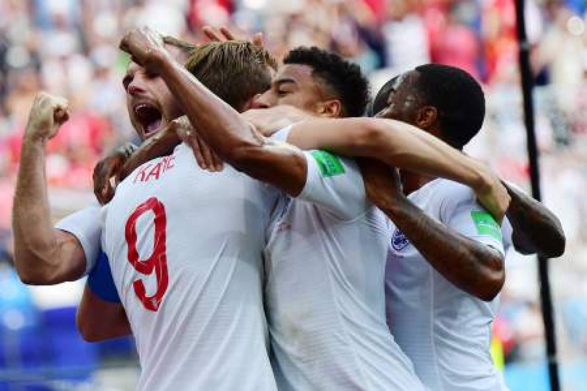 England's forward Harry Kane (2ndL) celebrates with teammates after scoring a penalty during the Russia 2018 World Cup Group G football match between England and Panama at the Nizhny Novgorod Stadium in Nizhny Novgorod on June 24, 2018. / AFP PHOTO / Martin BERNETTI / RESTRICTED TO EDITORIAL USE - NO MOBILE PUSH ALERTS/DOWNLOADS