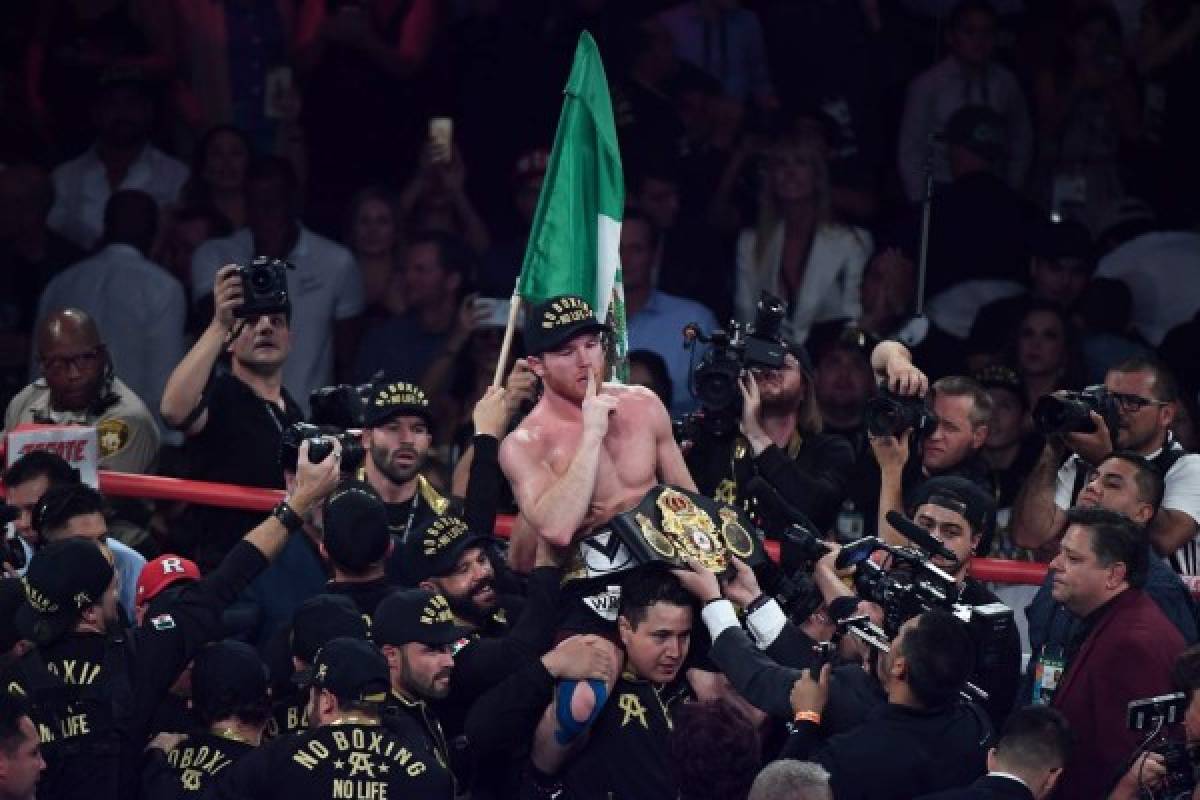 LAS VEGAS, NV - SEPTEMBER 15: Canelo Alvarez celebrates after his majority decision win over Gennady Golovkin during their WBC/WBA middleweight title fight at T-Mobile Arena on September 15, 2018 in Las Vegas, Nevada. Ethan Miller/Getty Images/AFP