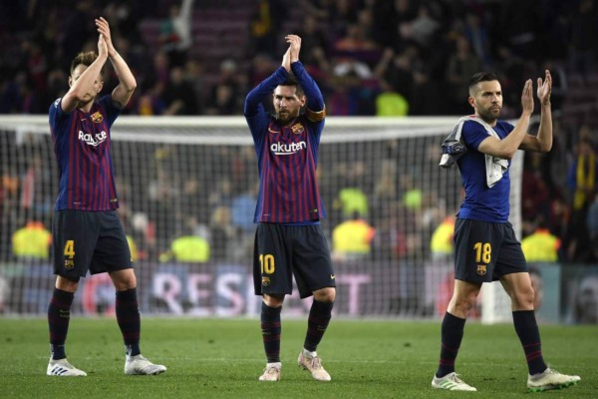 (L-R) Barcelona's Croatian midfielder Ivan Rakitic, Barcelona's Argentinian forward Lionel Messi and Barcelona's Spanish defender Jordi Alba celebrate at the end of the UEFA Champions League semi-final first leg football match between Barcelona and Liverpool at the Camp Nou Stadium in Barcelona on May 1, 2019. (Photo by LLUIS GENE / AFP)