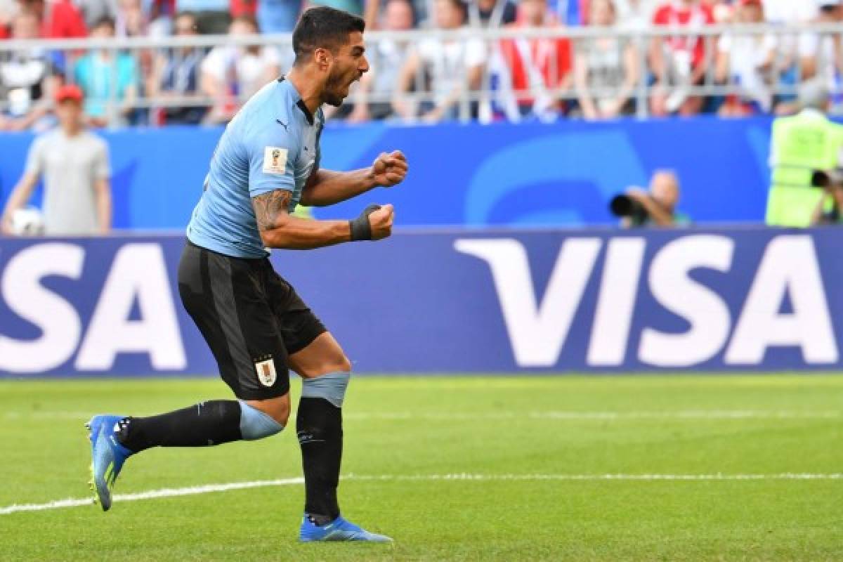 Uruguay's forward Luis Suarez celebrates his team's second goal during the Russia 2018 World Cup Group A football match between Uruguay and Russia at the Samara Arena in Samara on June 25, 2018. / AFP PHOTO / EMMANUEL DUNAND / RESTRICTED TO EDITORIAL USE - NO MOBILE PUSH ALERTS/DOWNLOADS