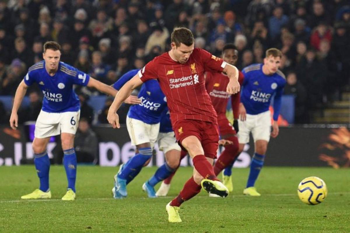 Liverpool's English midfielder James Milner scores their second goal from the penalty spot during the English Premier League football match between Leicester City and Liverpool at King Power Stadium in Leicester, central England on December 26, 2019. (Photo by Oli SCARFF / AFP) / RESTRICTED TO EDITORIAL USE. No use with unauthorized audio, video, data, fixture lists, club/league logos or 'live' services. Online in-match use limited to 120 images. An additional 40 images may be used in extra time. No video emulation. Social media in-match use limited to 120 images. An additional 40 images may be used in extra time. No use in betting publications, games or single club/league/player publications. /