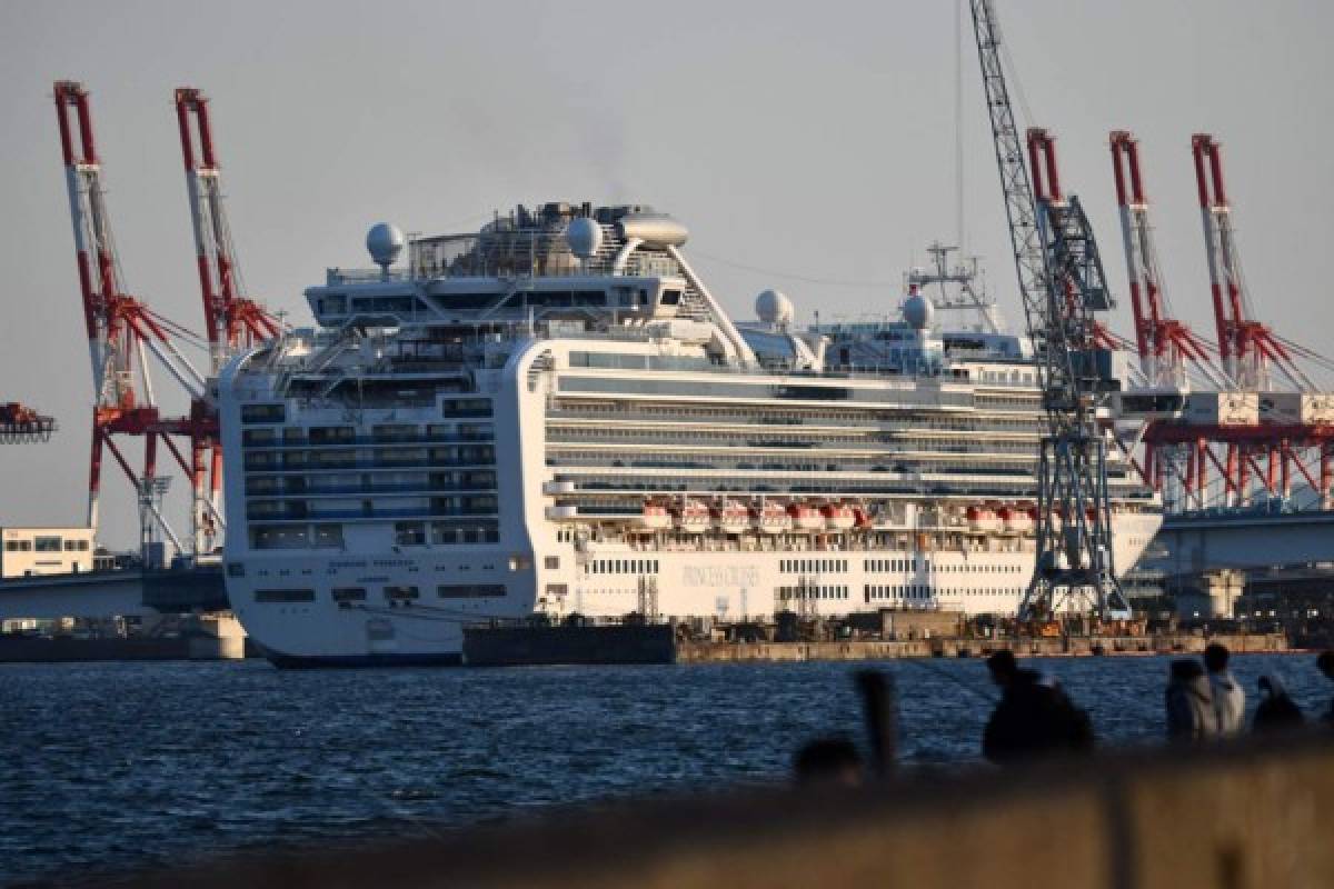 The Diamond Princess cruise ship is seen at a pier in the port of Yokohama on March 25, 2020. - Last month, the cruise ship Diamond Princess was quarantined off the coast of Japan and more than 700 people of the 3,700 passengers and crew on board tested positive for COVID-19. (Photo by Kazuhiro NOGI / AFP)