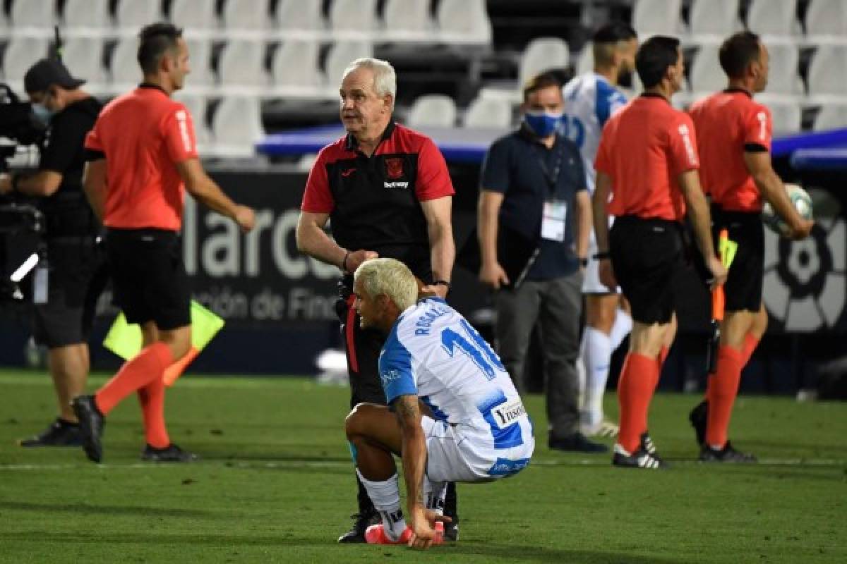 CORRECTION - Leganes' Mexican coach Javier Aguirre conforts Leganes' Venezuelan defender Roberto Rosales after the Spanish league football match Club Deportivo Leganes SAD against Real Madrid CF at the Estadio Municipal Butarque in Leganes on July 19, 2020. (Photo by PIERRE-PHILIPPE MARCOU / AFP) / The erroneous mention[s] appearing in the metadata of this photo by PIERRE-PHILIPPE MARCOU has been modified in AFP systems in the following manner: [Leganes' Mexican coach Javier Aguirre] instead of [Leganes' Argentinian coach Mauricio Pellegrino]. Please immediately remove the erroneous mention[s] from all your online services and delete it (them) from your servers. If you have been authorized by AFP to distribute it (them) to third parties, please ensure that the same actions are carried out by them. Failure to promptly comply with these instructions will entail liability on your part for any continued or post notification usage. Therefore we thank you very much for all your attention and prompt action. We are sorry for the inconvenience this notification may cause and remain at your disposal for any further information you may require.