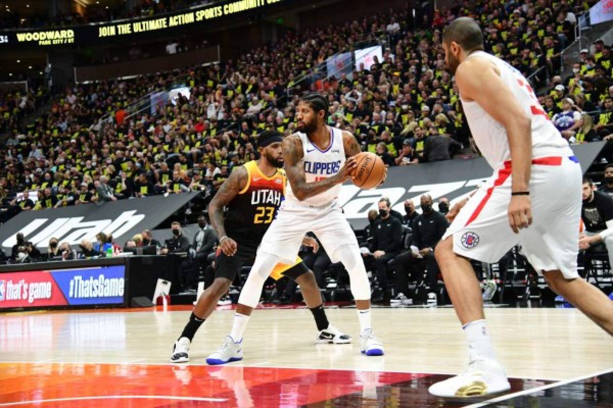 SALT LAKE CITY, UT - JUNE 16: Paul George #13 of the LA Clippers handles the ball during the game against the Utah Jazz during Round 2, Game 5 of the 2021 NBA Playoffs on June 16, 2021 at vivint.SmartHome Arena in Salt Lake City, Utah. NOTE TO USER: User expressly acknowledges and agrees that, by downloading and or using this Photograph, User is consenting to the terms and conditions of the Getty Images License Agreement. Mandatory Copyright Notice: Copyright 2021 NBAE Adam Pantozzi/NBAE via Getty Images/AFP (Photo by Adam Pantozzi / NBAE / Getty Images / Getty Images via AFP)