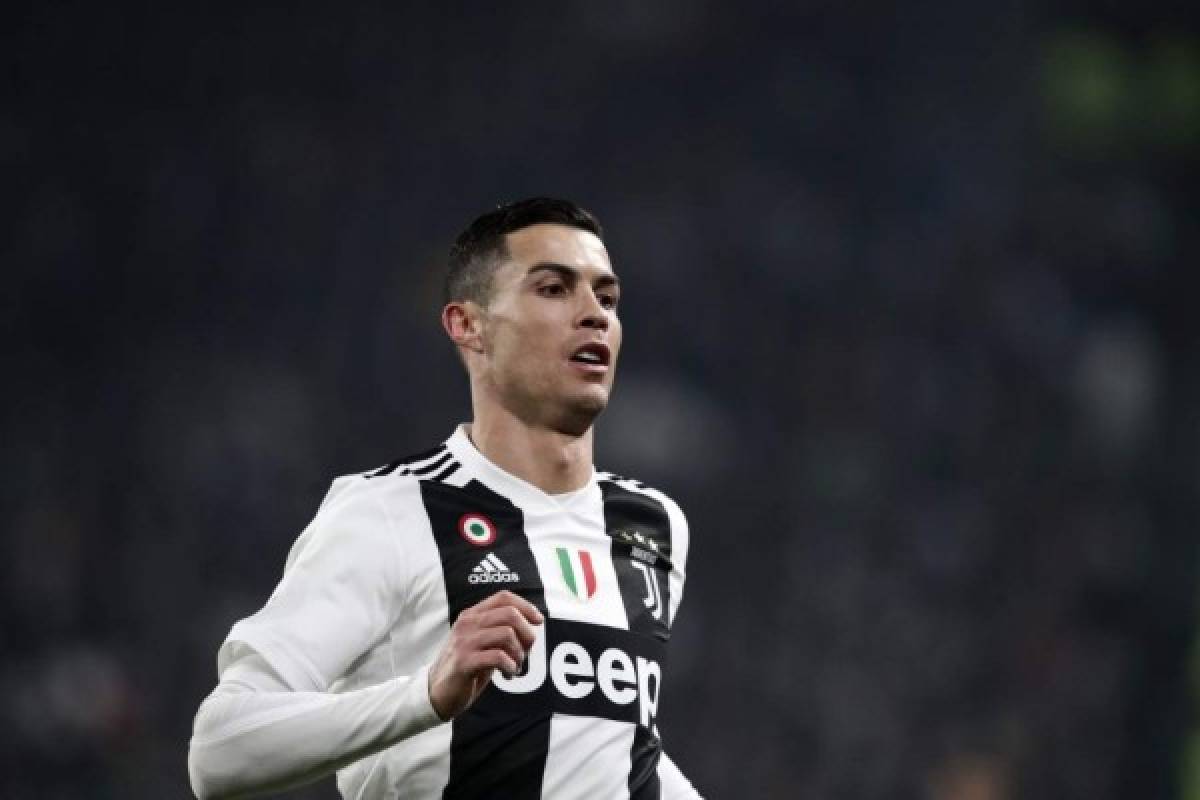(FILES) In this file photo taken on December 07, 2018 Juventus' Portuguese forward Cristiano Ronaldo runs with the ball during the Serie A soccer match Juventus vs InterMilan at the Stadio delle Alpi in Turin. - Cristiano Ronaldo will not face rape charges in Nevada, prosecutors said on July 22, 2019. (Photo by Isabella BONOTTO / AFP)