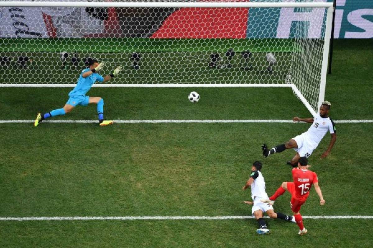 Switzerland's midfielder Blerim Dzemaili (2R) shoots and scores the opening goal during the Russia 2018 World Cup Group E football match between Switzerland and Costa Rica at the Nizhny Novgorod Stadium in Nizhny Novgorod on June 27, 2018. / AFP PHOTO / ANTONIN THUILLIER / RESTRICTED TO EDITORIAL USE - NO MOBILE PUSH ALERTS/DOWNLOADS