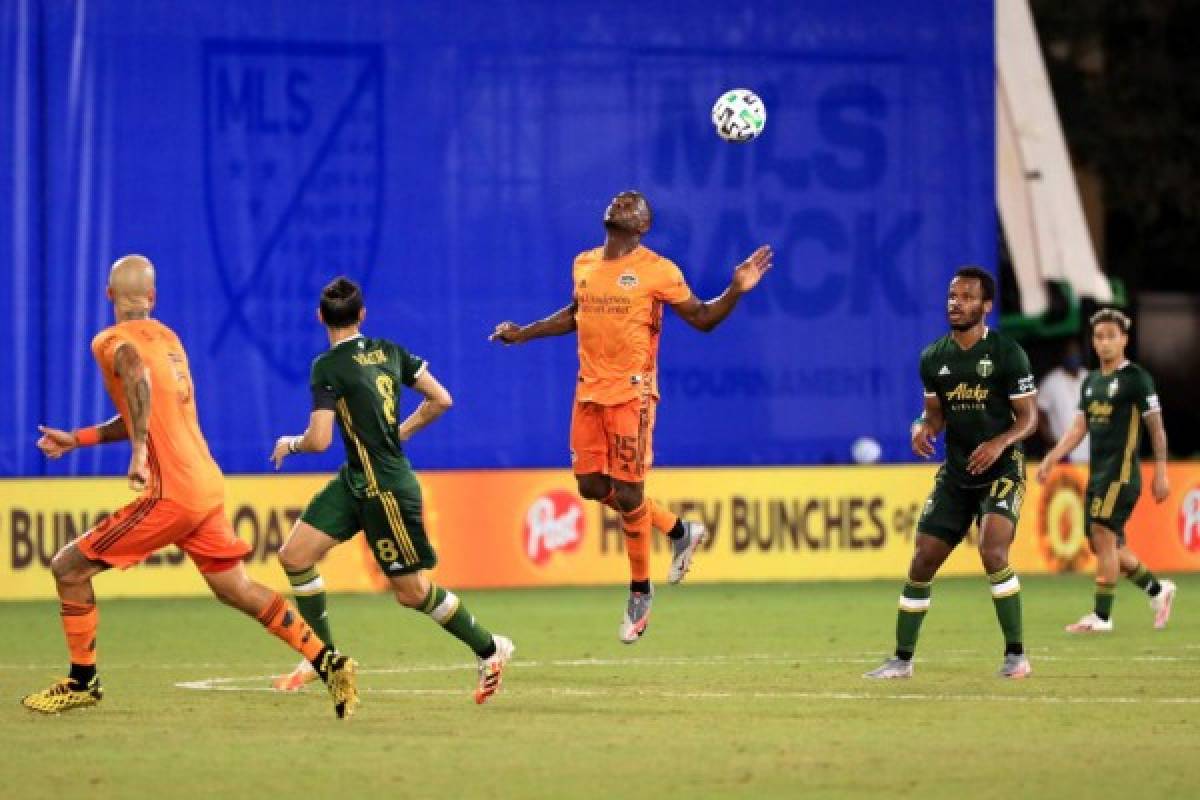 REUNION, FLORIDA - JULY 18: Maynor Figueroa #15 of Houston Dynamo jumps for a header in the first half against the Portland Timbers during the MLS Is Back Tournament at ESPN Wide World of Sports Complex on July 18, 2020 in Reunion, Florida. Mike Ehrmann/Getty Images/AFP