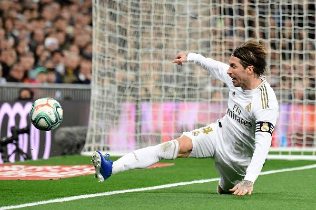 Real Madrid's Spanish defender Sergio Ramos tries to control the ball during the Spanish league football match Real Madrid CF against Athletic Club Bilbao at the Santiago Bernabeu stadium in Madrid on December 22, 2019. (Photo by JAVIER SORIANO / AFP)
