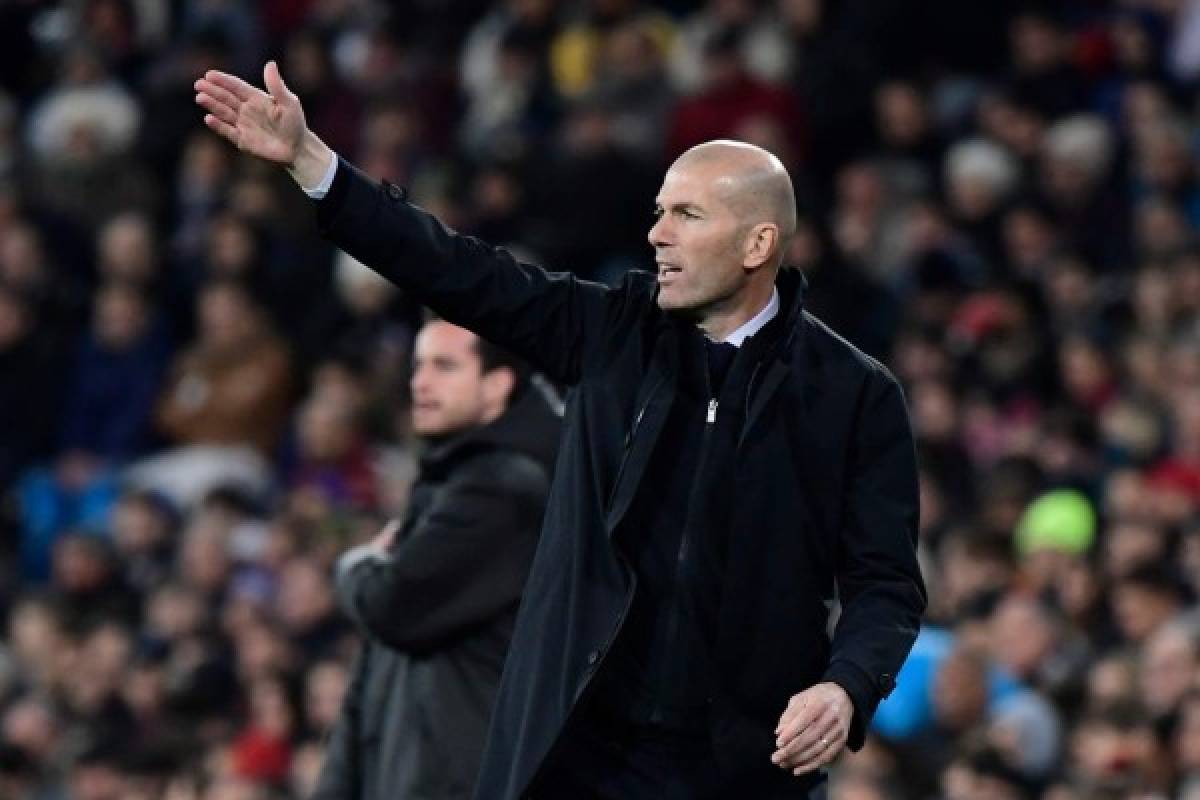Real Madrid's French coach Zinedine Zidane reacts during the Spanish league football match Real Madrid CF against Athletic Club Bilbao at the Santiago Bernabeu stadium in Madrid on December 22, 2019. (Photo by JAVIER SORIANO / AFP)